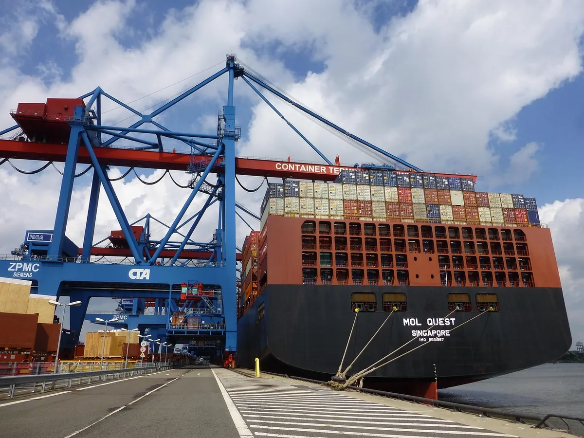Why WhatsApp and bilingual handling are not optional Container terminal with cranes and stacked containers