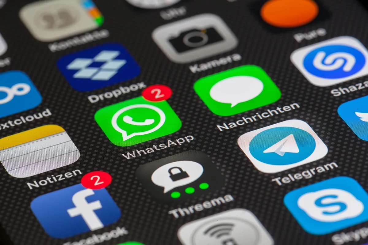 Text-back means WhatsApp, in Arabic and English Smartphone showing a WhatsApp conversation